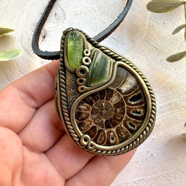 Handmade unisex necklace featuring Ammonite, Peridot and Moldavite natural gemstones.