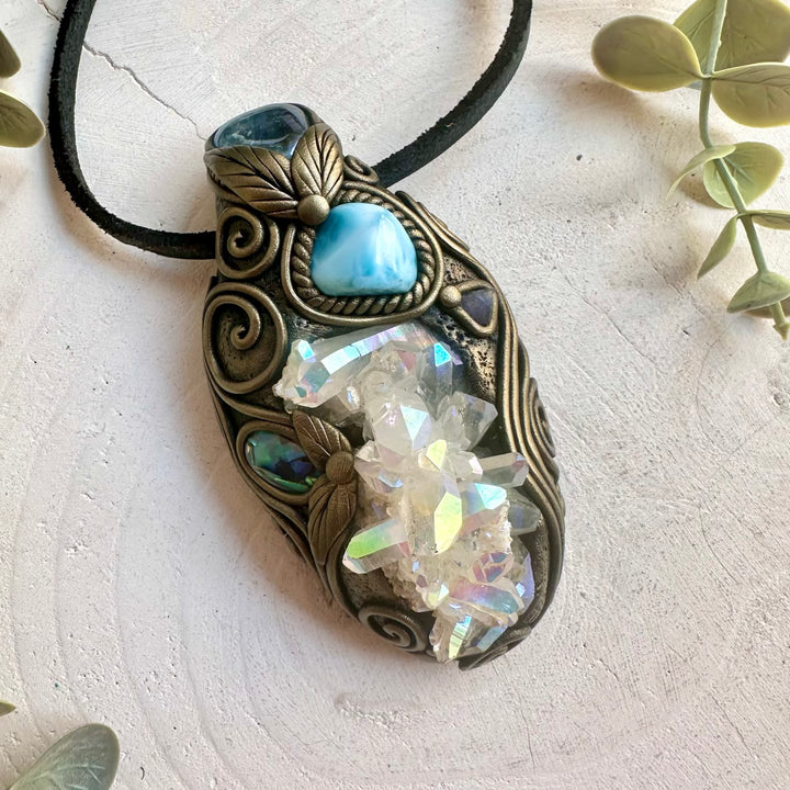 Spiritual healing crystal tool featuring an Angel Aura Quartz Cluster with Raw Tanzanite and Abalone Seashell.
