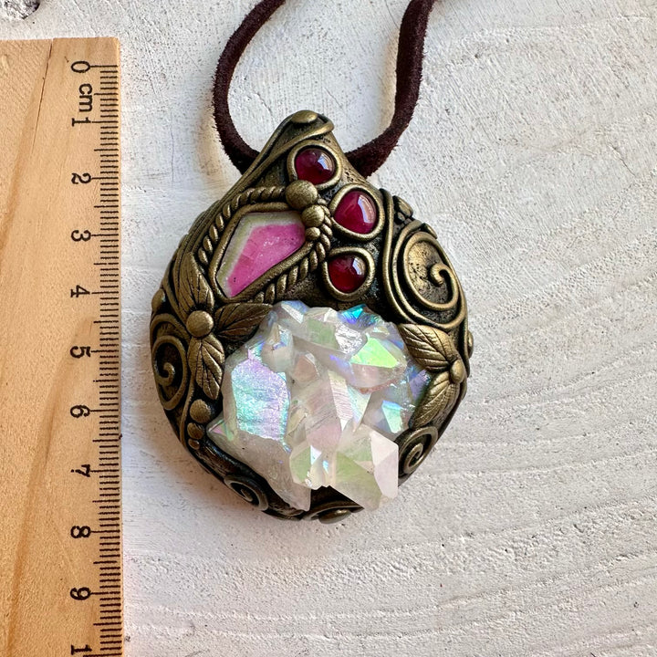 Handmade Angel Aura Quartz Cluster pendant necklace featuring Watermelon Tourmaline and Rhodolite Garnet, a one of a kind crystal jewelry piece combining iridescent beauty, vibrant natural gemstones and spiritual symbolism.