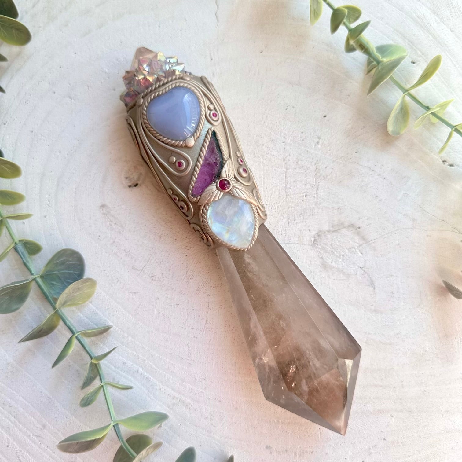 Healing crystal wand with smoky quartz and natural gemstones for meditation rituals and manifestation