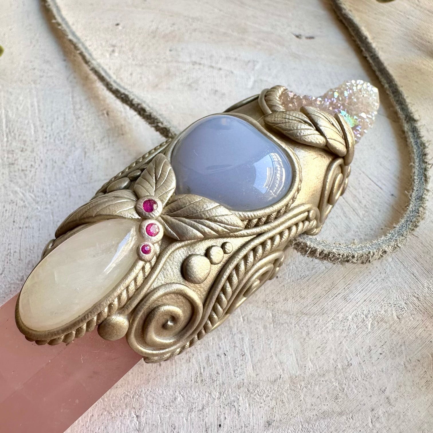 Handmade metaphysical healing tool featuring Rose Quartz, Spirit Quartz, Moonstone and natural Ruby.