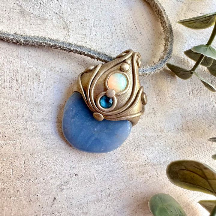 An enchanting spiritual gemstone talisman inspired by peace, intuition, clarity, communication, creativity and spiritual connection. A unique handmade crystal necklace for meditation, energy work, intention setting and everyday wear.