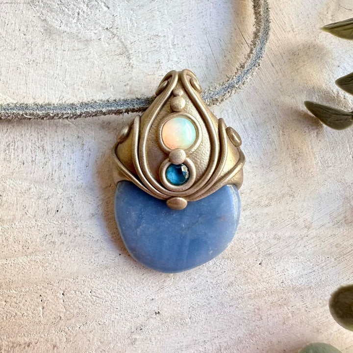 Delicate gemstone jewelry combining Angelite and Ethiopian Opal with deep blue Topaz.
