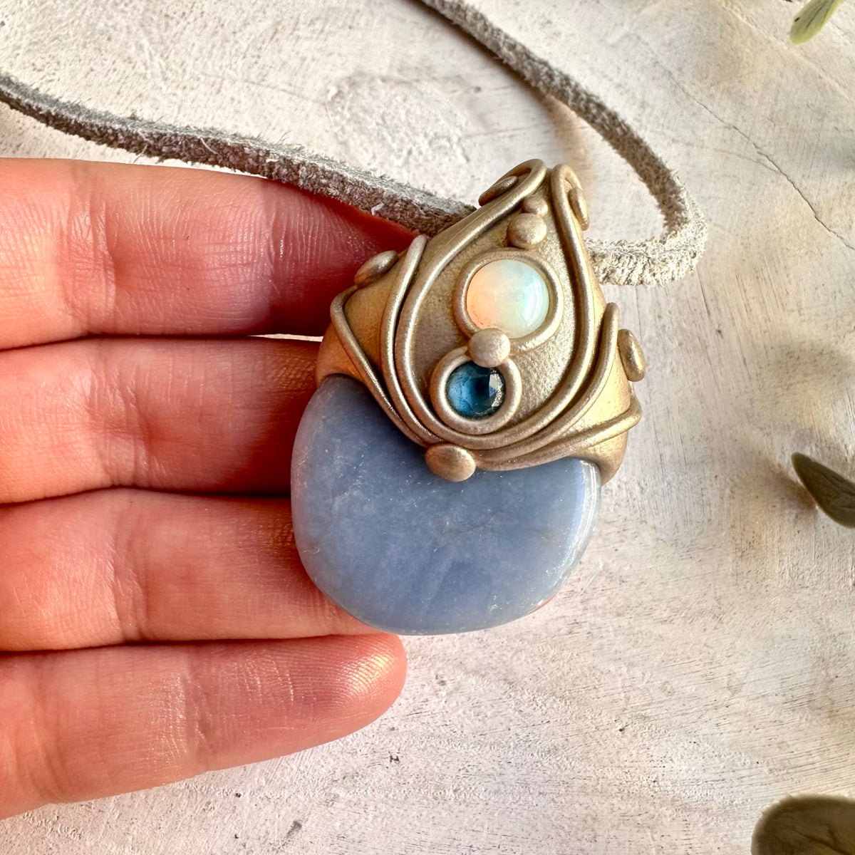 Handmade Angelite pendant necklace accented with Ethiopian Opal and London Blue Topaz.