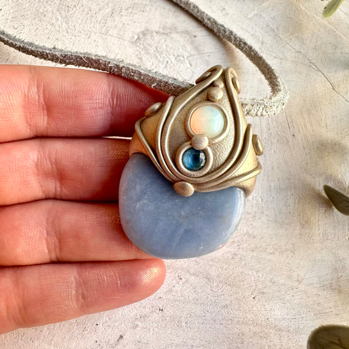 Handmade Angelite pendant necklace accented with Ethiopian Opal and London Blue Topaz.