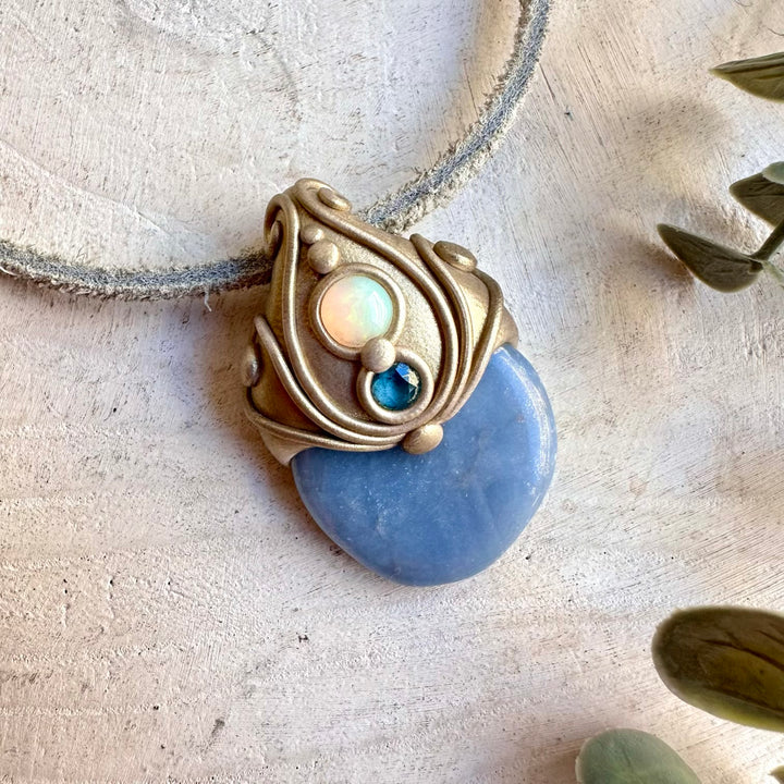 Handmade Angelite with Ethiopian Opal and London Blue Topaz pendant necklace, a one of a kind healing crystal jewelry piece combining soft blue Angelite with the vibrant iridescence of Ethiopian Opal and the deep ocean-blue beauty of London Blue Topaz.