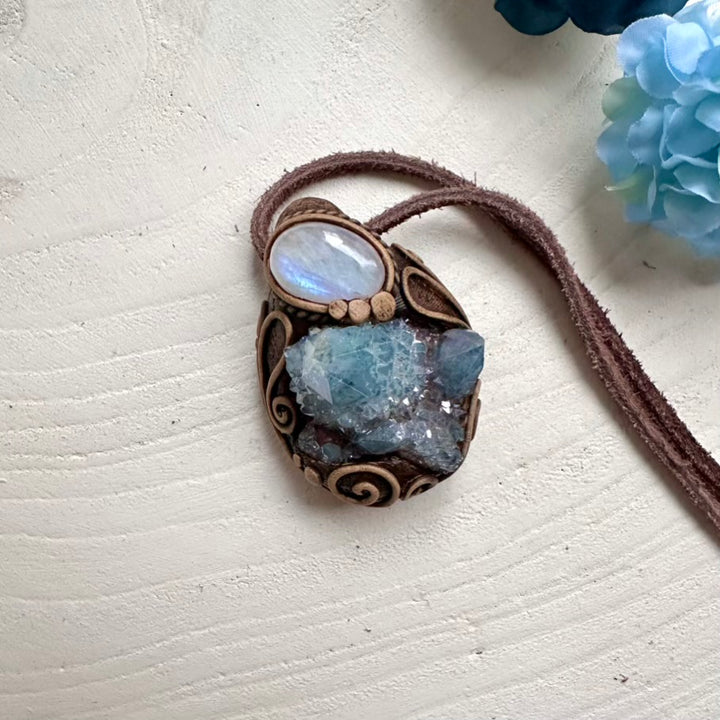 Spiritual pendant featuring Aqua Aura Quartz cluster and Moonstone