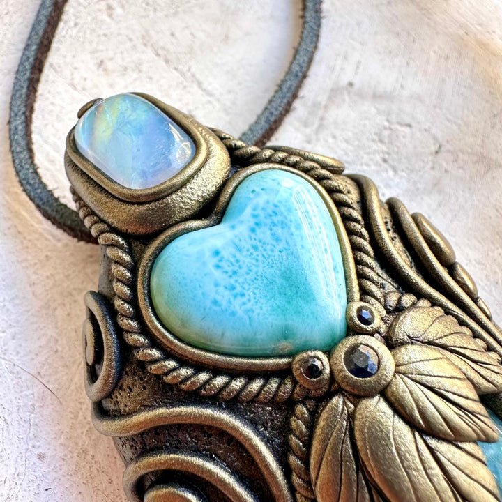 One of a kind spiritual jewelry piece with Rainbow Moonstone, Blue Sapphire and Aqua Aura Quartz.