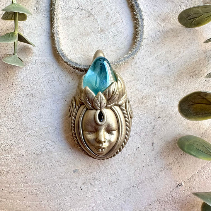 Handmade Aqua Aura Quartz and Blue Sapphire Goddess necklace, a one of a kind spiritual gemstone jewelry piece combining luminous blue-toned Quartz with deep natural Sapphire.