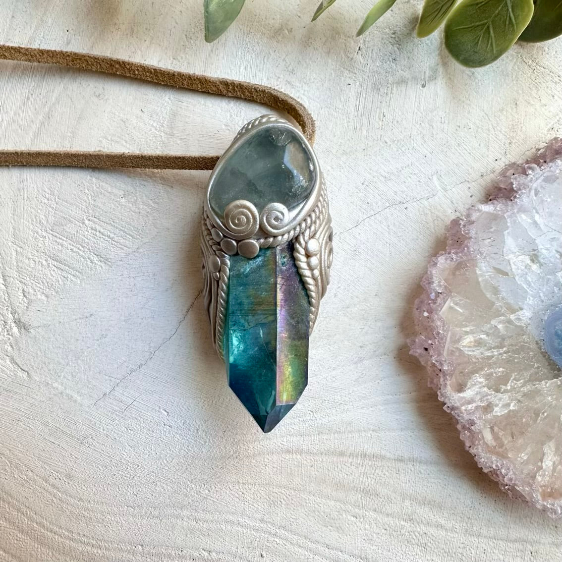 Aqua aura quartz paired with celestite in a spiritual necklace