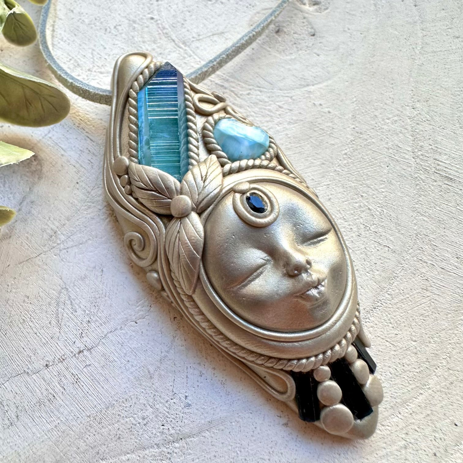 Larimar heart paired with aqua aura quartz and sapphire in a necklace