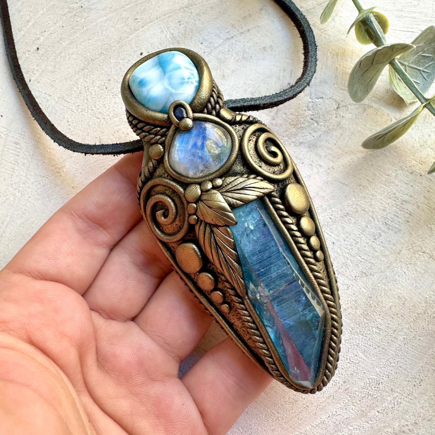 Handmade Aqua Aura Quartz healing crystal talisman necklace featuring Larimar, Rainbow Moonstone and Blue Sapphire.