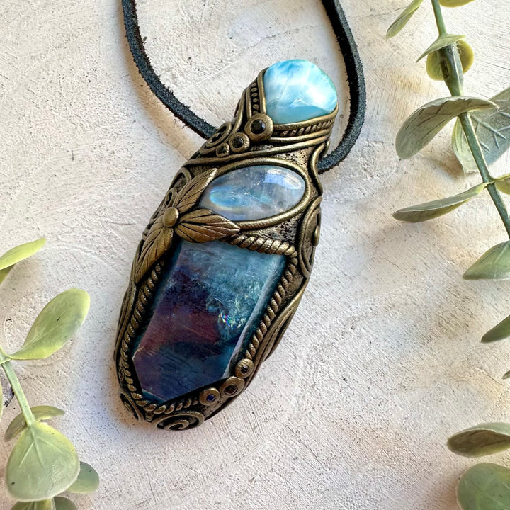 Handmade Aqua Aura Quartz crystal talisman pendant necklace featuring Larimar, Rainbow Moonstone and Blue Sapphire.