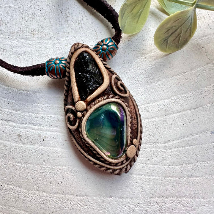 Spiritual gemstone pendant handcrafted with Aqua Aura Quartz and rare Moldavite.