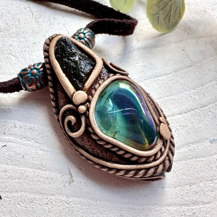 Handmade crystal necklace with Aqua Aura Quartz for high vibration energy and Moldavite for transformation.