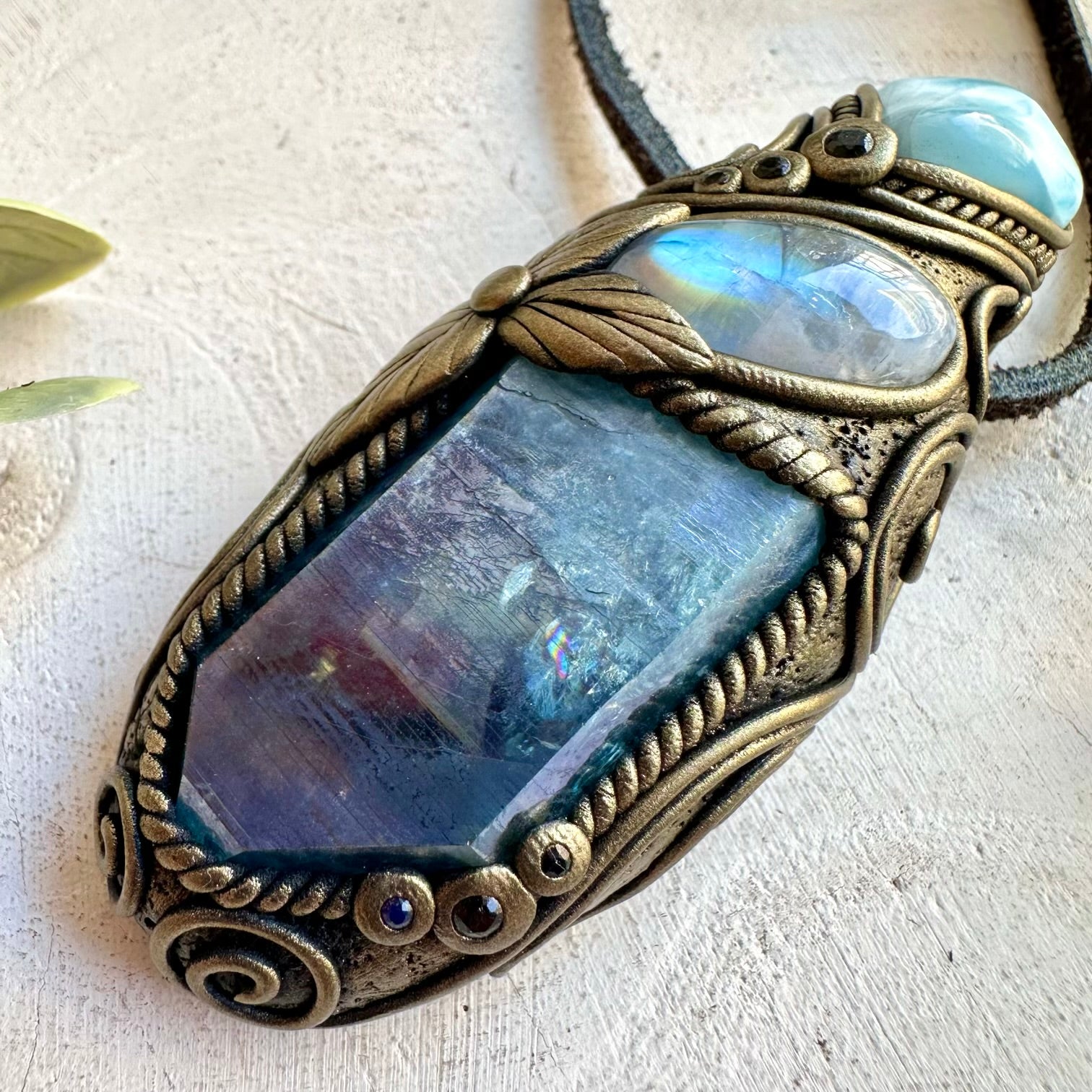 Handmade energy healing spiritual jewelry combining Aqua Aura Quartz with Larimar, Moonstone and Blue Sapphire.