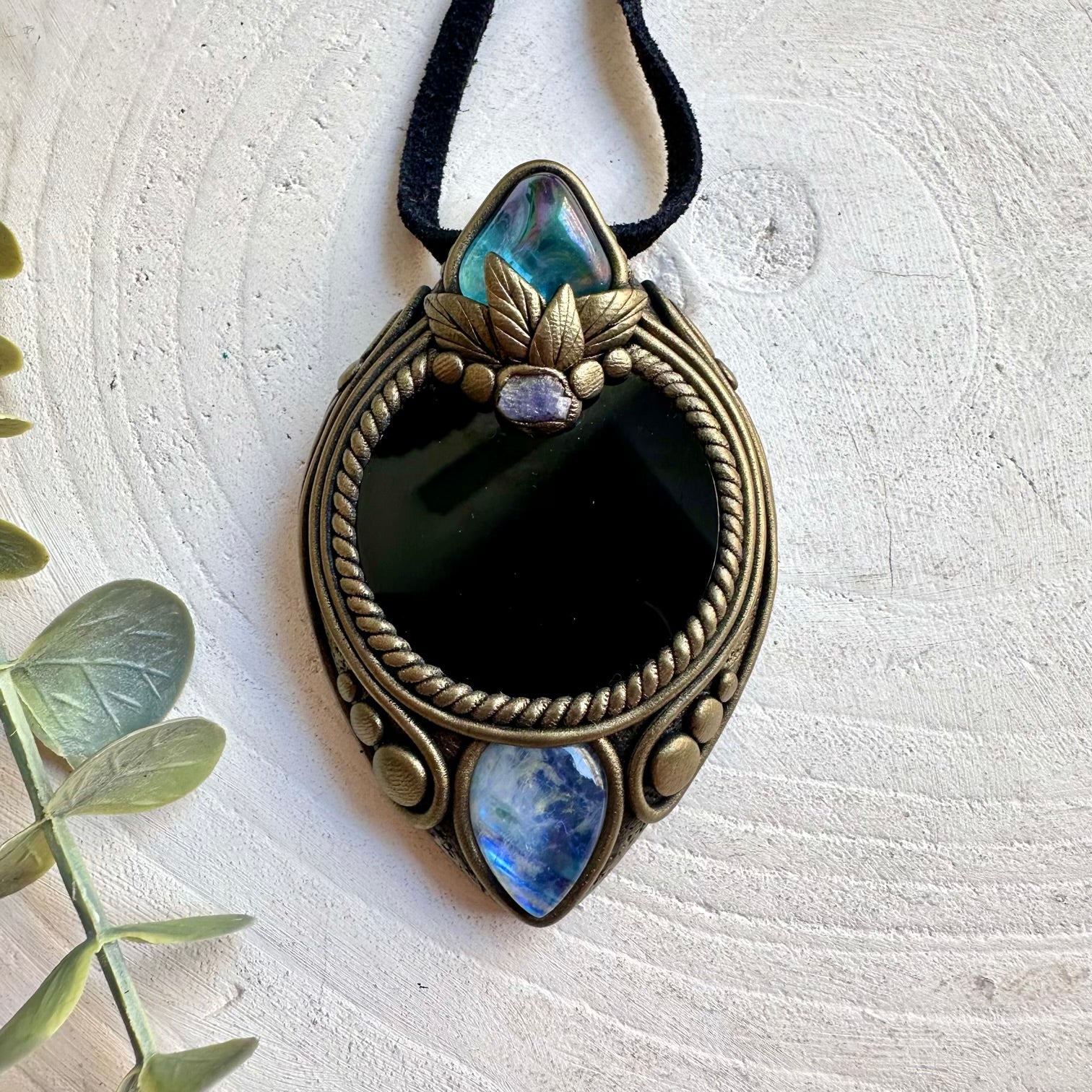 Handmade healing crystal pendant featuring Black Obsidian Mirror and genuine natural gemstones.
