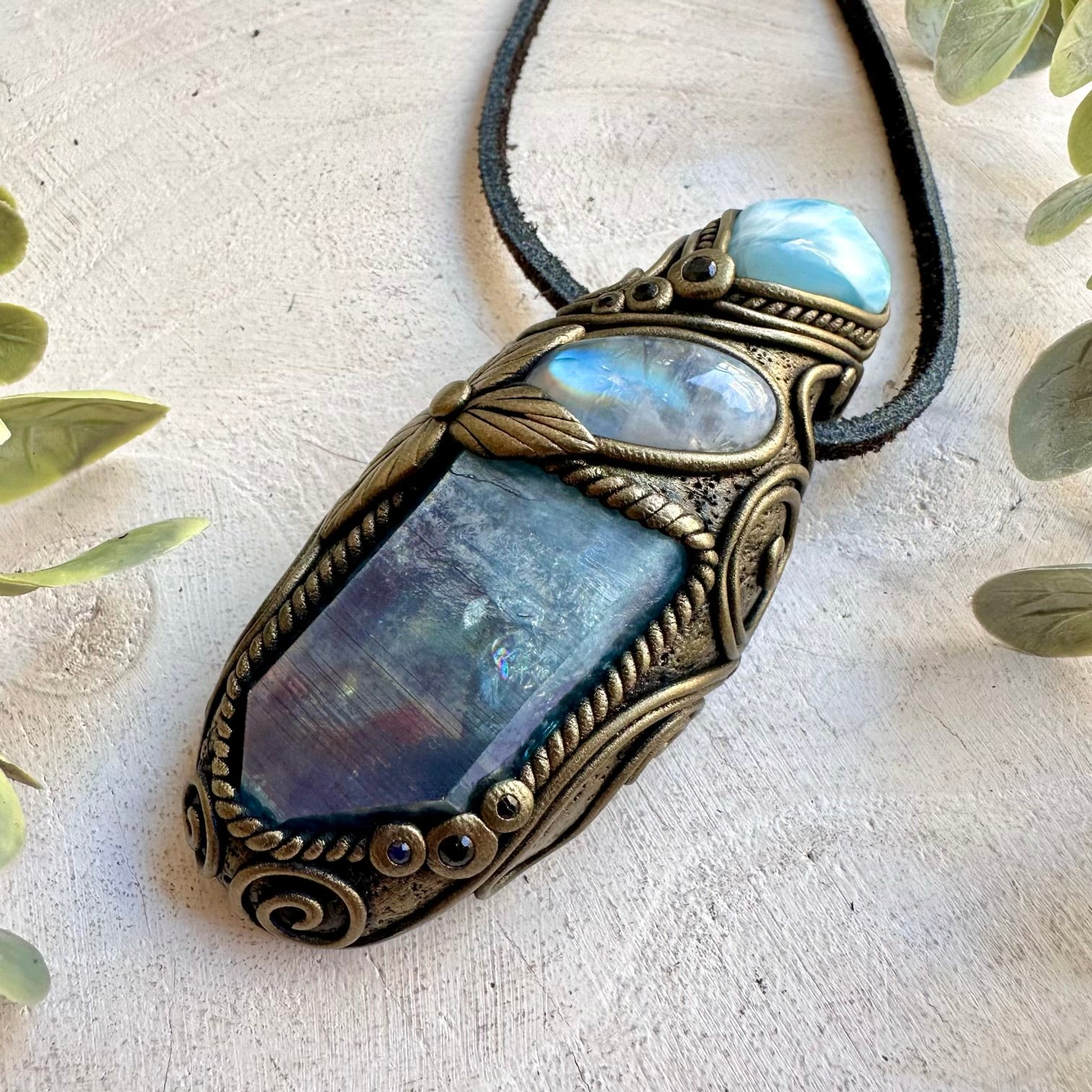 Natural gemstone pendant showcasing Aqua Aura Quartz with a beautiful Larimar accent.