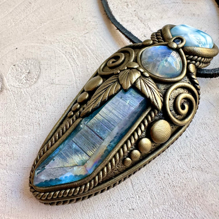 Handmade crystal jewelry with Larimar, Blue Sapphire and luminous Aqua Aura Quartz for meditation and energy healing work.