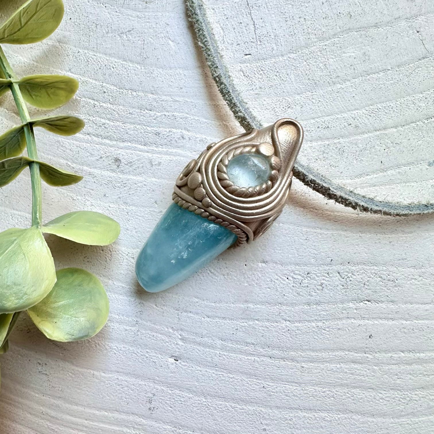 Protection amulet crystal necklace with aquamarine and blue topaz gemstones