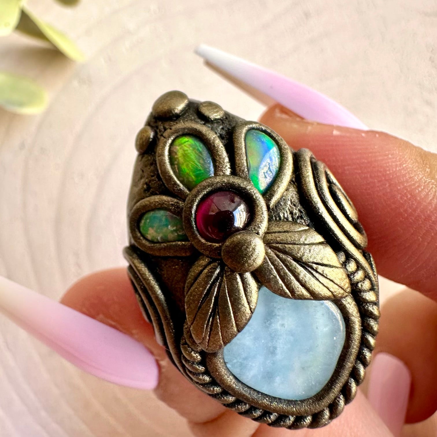 Aquamarine, Ethiopian Opal and Rhodolite Garnet ring handcrafted as unique gemstone jewelry.