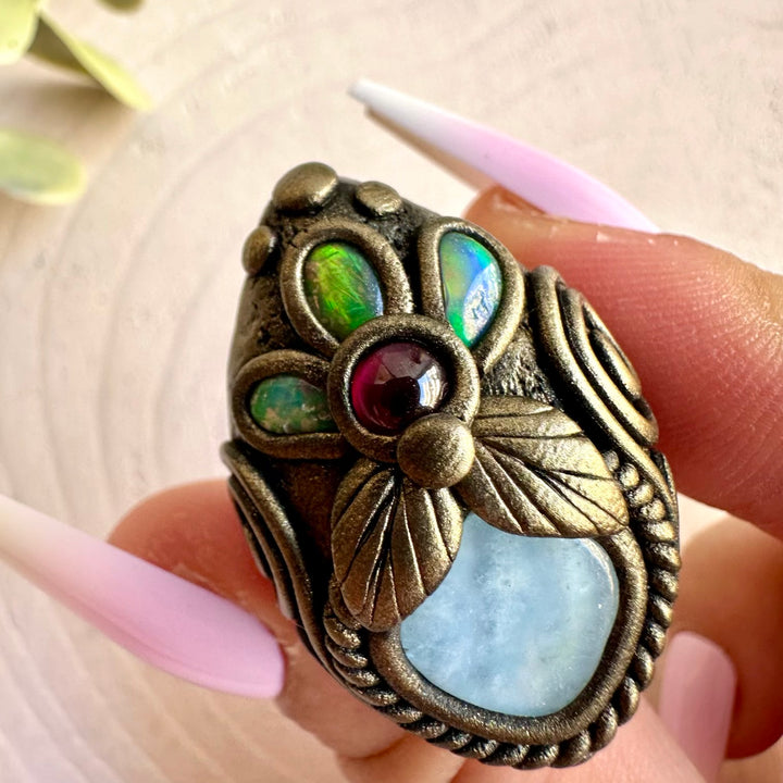 Aquamarine, Ethiopian Opal and Rhodolite Garnet ring handcrafted as unique gemstone jewelry.