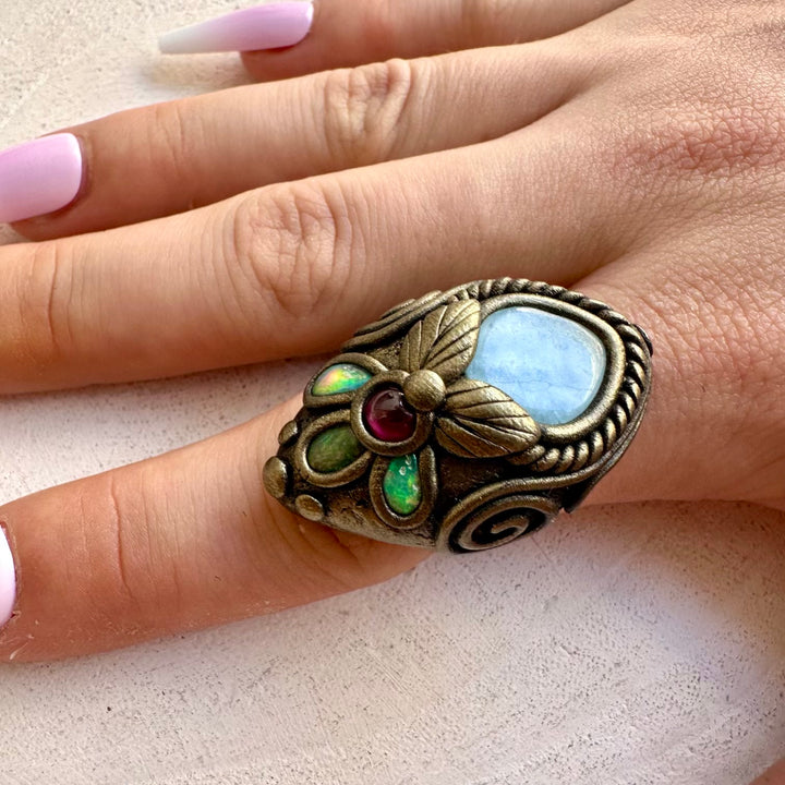 Natural gemstone adjustable ring handcrafted with Aquamarine, Ethiopian Opal and Rhodolite Garnet.
