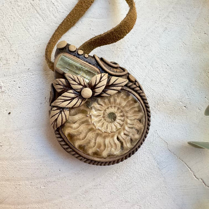 Unisex crystal necklace featuring ancient ammonite fossil