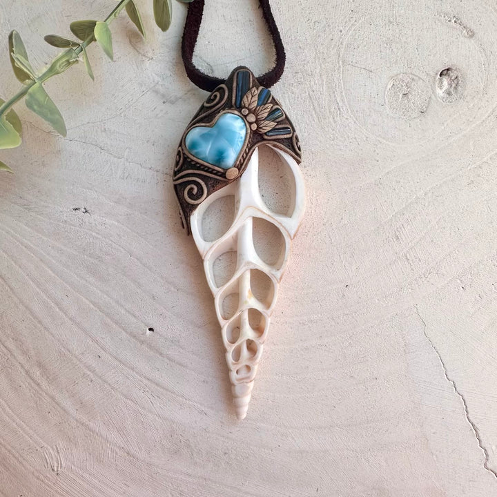 Handmade ocean-inspired necklace featuring an Arabian Tibia shell slice