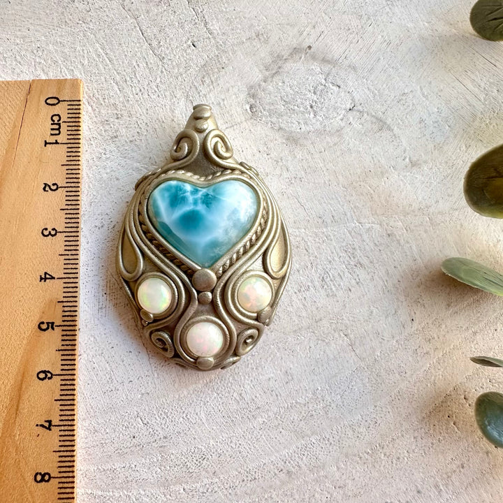 Handmade pendant necklace featuring a Larimar Heart and natural Ethiopian Opal.