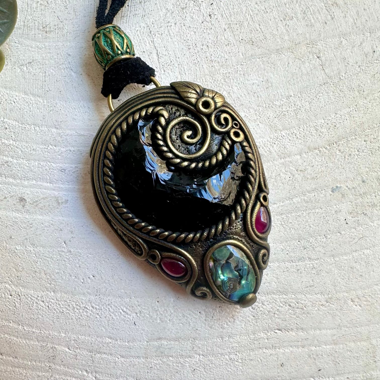 One of a kind spiritual necklace featuring a Black Obsidian Moon with shimmering Abalone Seashell.