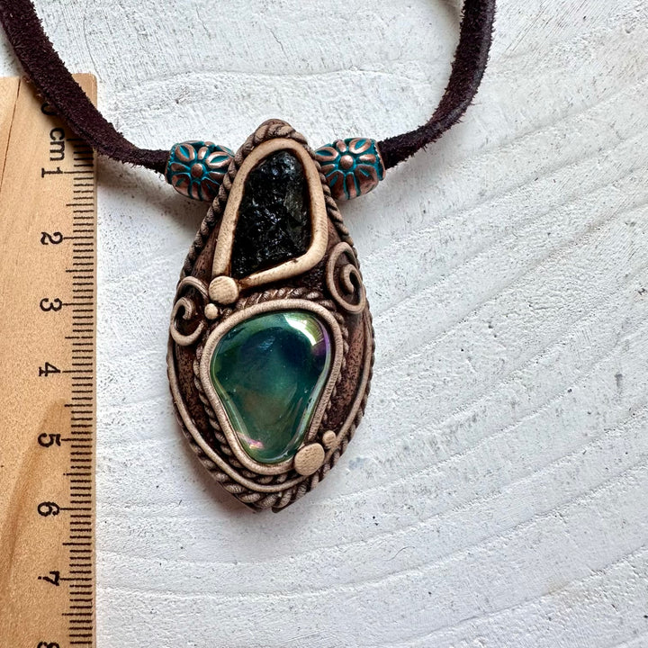 Handmade Aqua Aura Quartz and Moldavite necklace featuring genuine natural healing crystals.