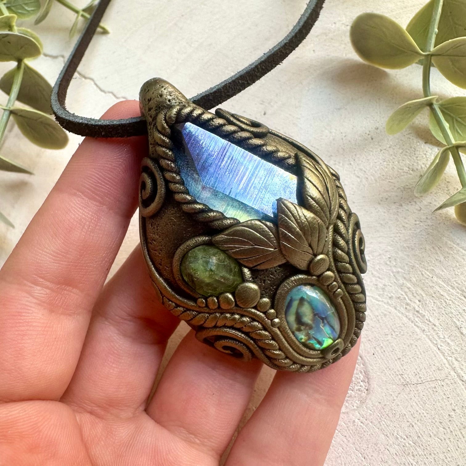 Artisan gemstone pendant featuring shimmering Aqua Aura Quartz with Abalone Seashell and Peridot.