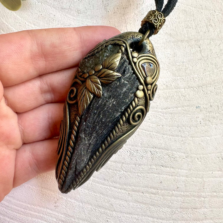 Handmade spiritual jewelry with Black Kyanite, Moldavite and Garnet in a one of a kind design.