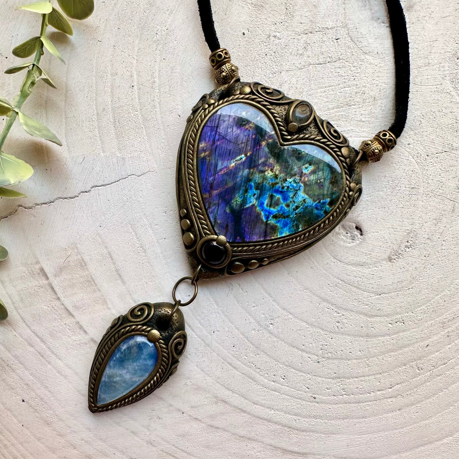 One of a kind crystal necklace handcrafted with a Purple Labradorite heart and genuine natural gemstones.