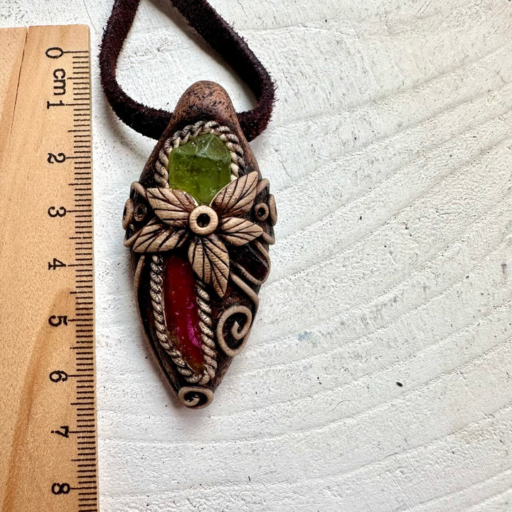 Healing crystal pendant featuring Watermelon Tourmaline, Peridot and Rhodolite Garnet in clay setting.