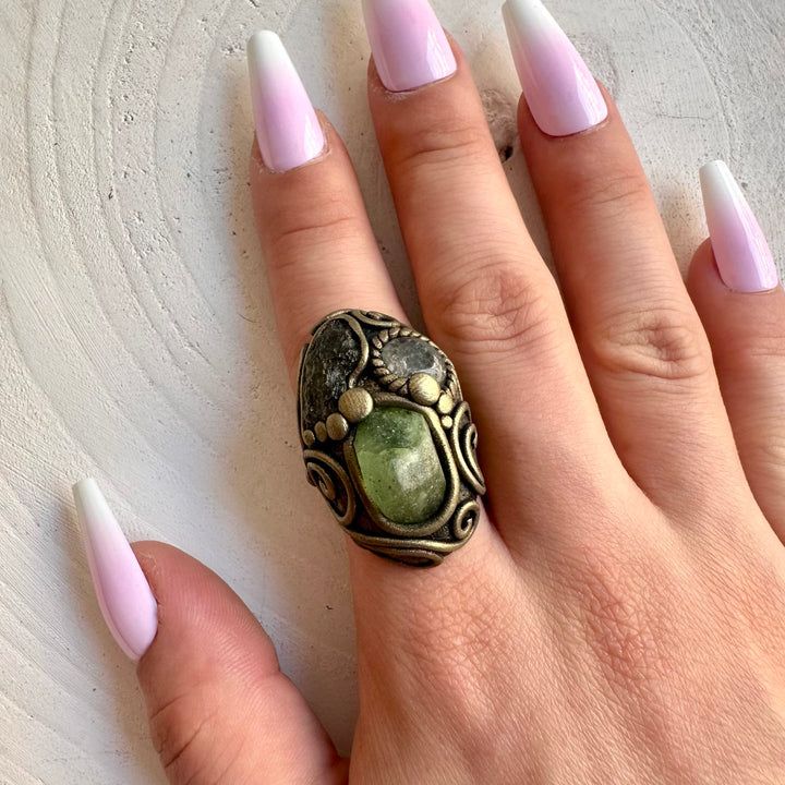 Handmade gemstone ring combining natural Moldavite with vibrant green Peridot and Clear Topaz.