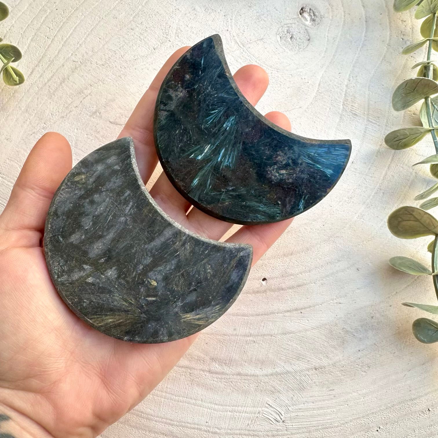 Natural astrophyllite stone carved in moon shape