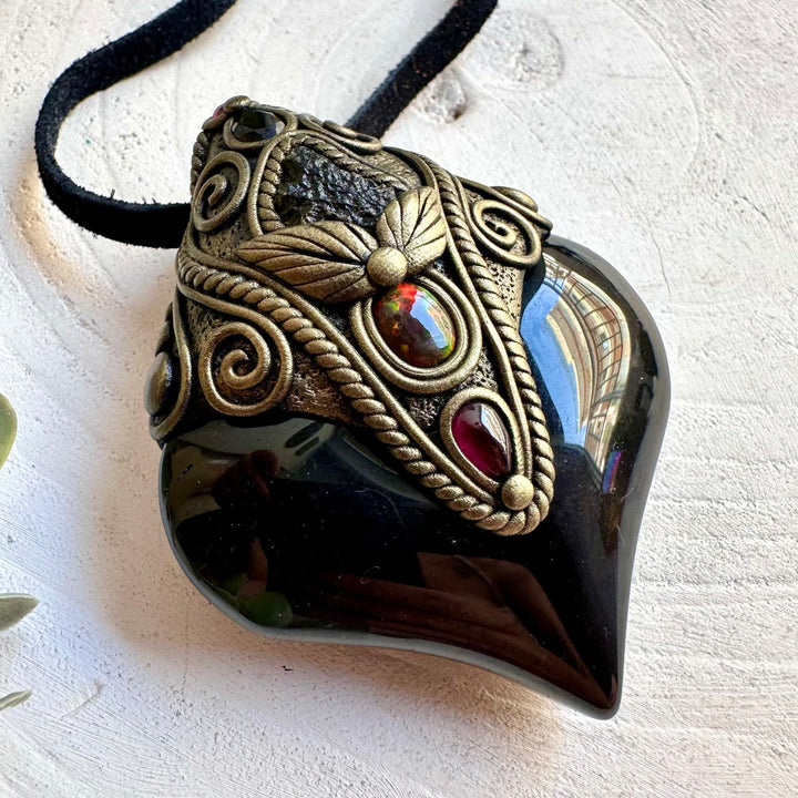 Unique spiritual pendant featuring Rainbow Obsidian with a raw Black Ethiopian Opal and Moldavite accents.