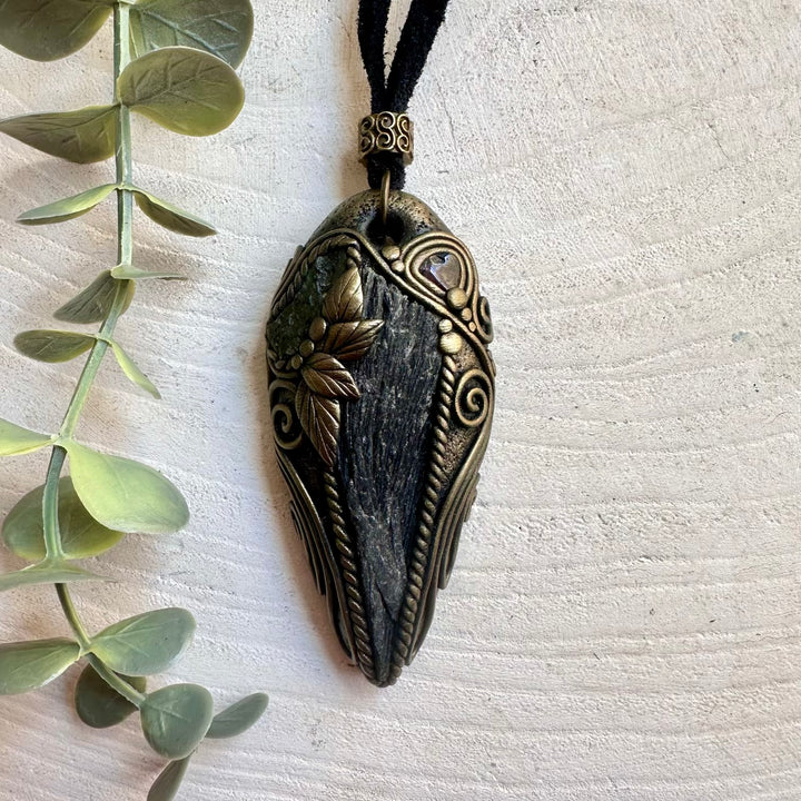 One of a kind crystal necklace featuring Black Kyanite, Moldavite and genuine Red Garnet.