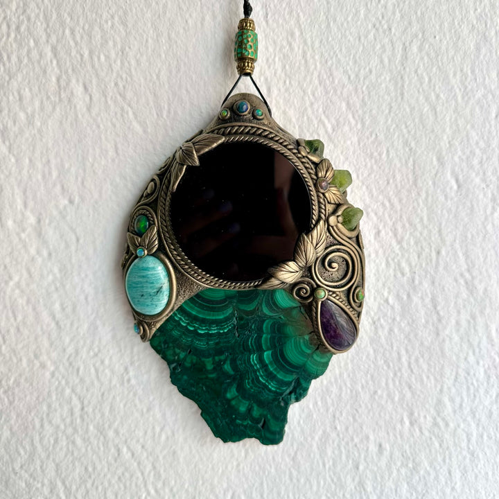 Artisan crystal mirror wall hanging decorated with natural Malachite, green Peridot and colorful Black Ethiopian Opal.