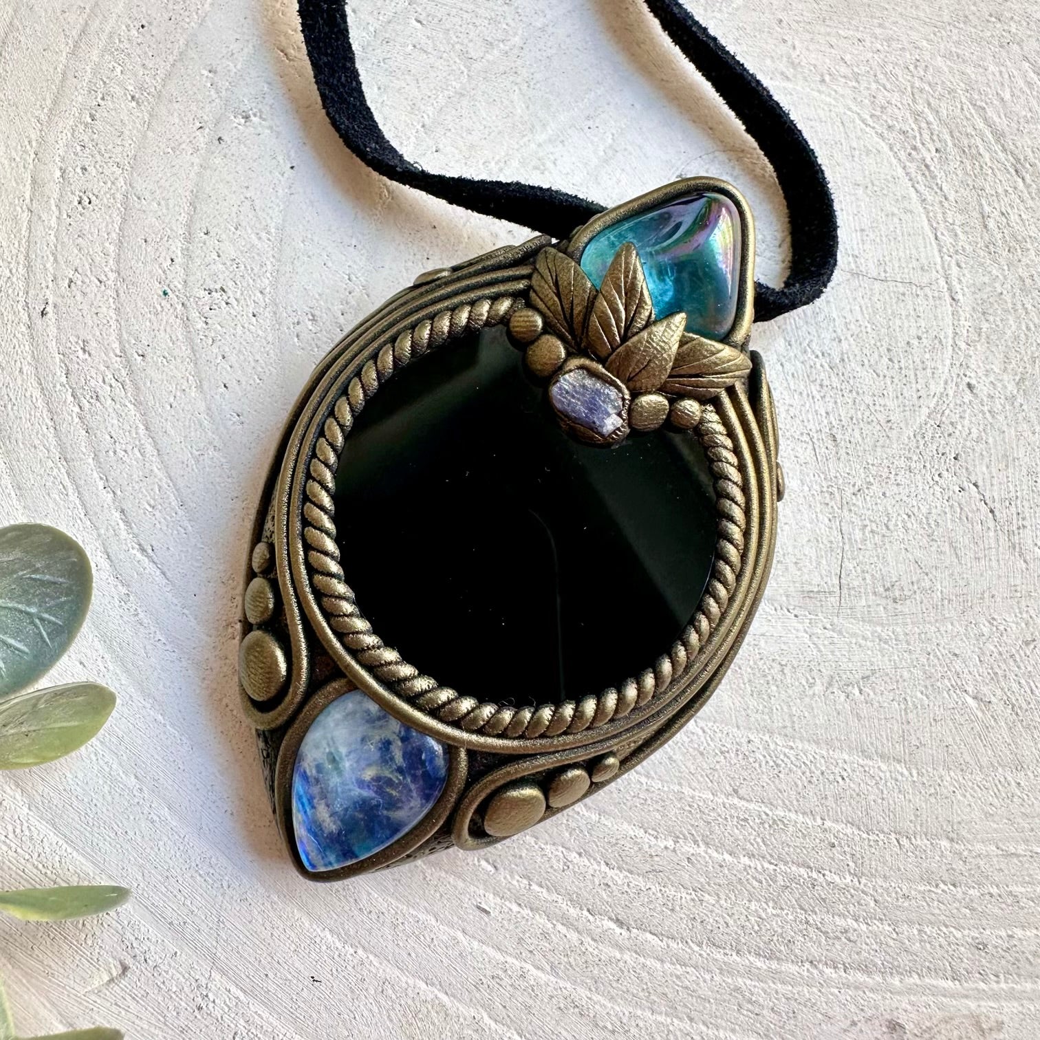 Black Obsidian Mirror pendant necklace handcrafted with Aqua Aura Quartz, Rainbow Moonstone and Raw Tanzanite.