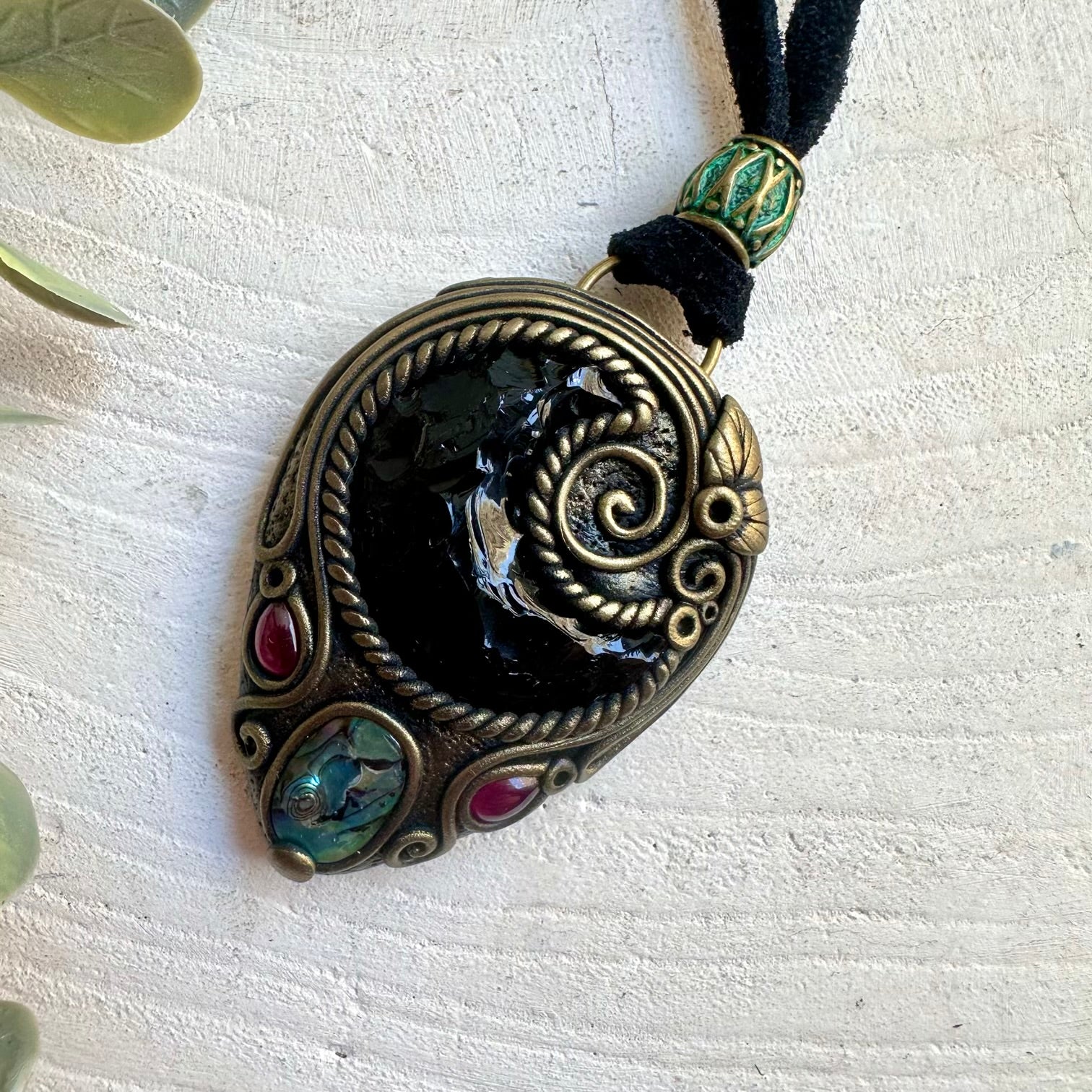 Handmade healing crystal necklace featuring a crescent Black Obsidian Moon and genuine natural gemstones.