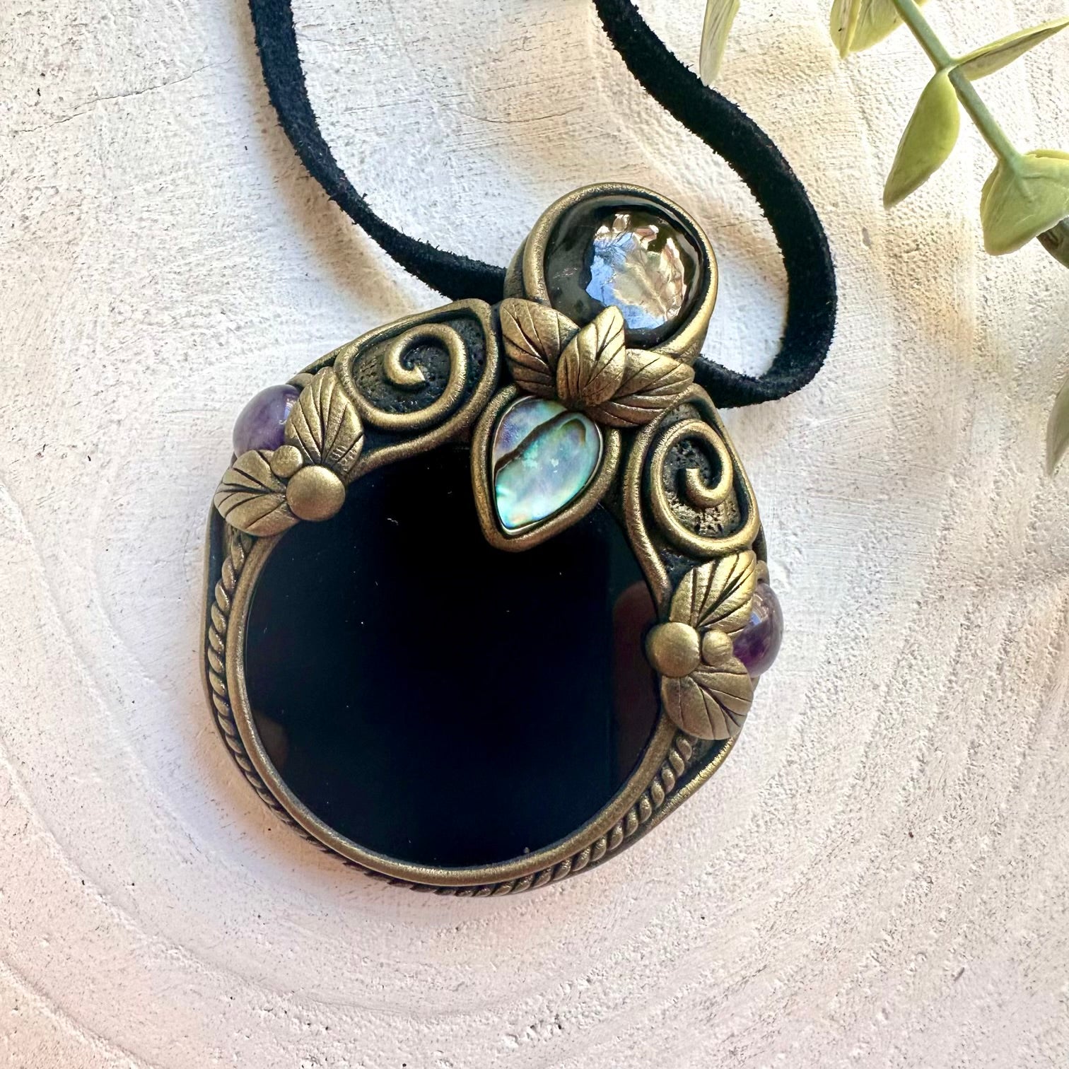 Mystical crystal pendant necklace featuring Black Obsidian, Amethyst, Garnet and Abalone Shell.