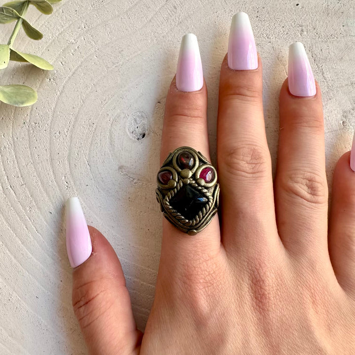 Black Onyx, Black Ethiopian Opal and Rhodolite Garnet ring handcrafted as unique healing crystal jewelry.