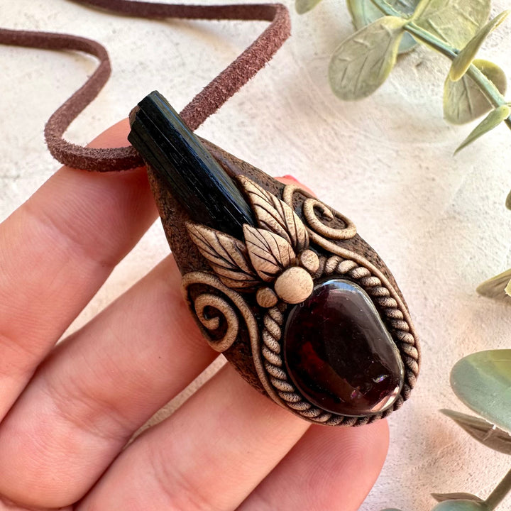 Close up of Black Tourmaline and Garnet pendant necklace