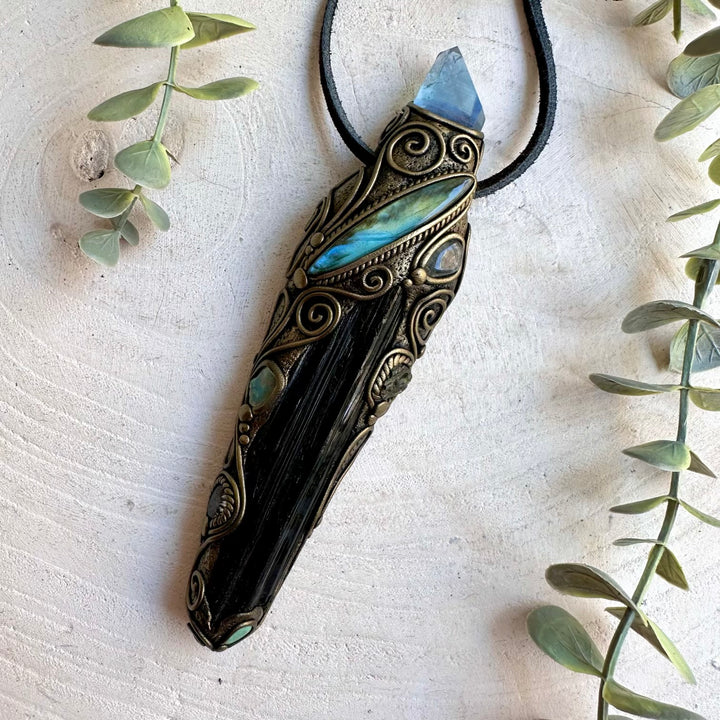 One of a kind crystal talisman with a long raw Black Tourmaline and luminous Aqua Aura Quartz.
