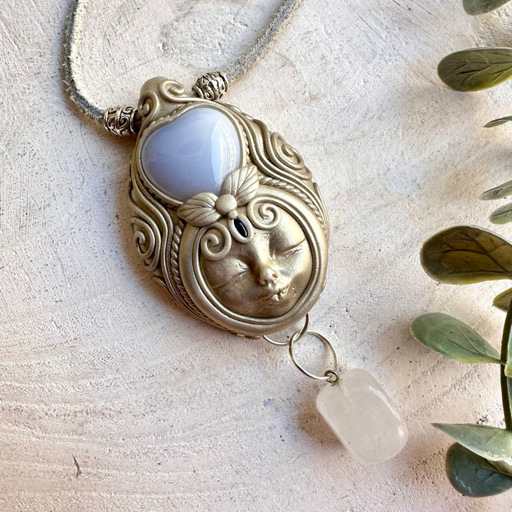 Unique Goddess pendant combining a Blue Chalcedony Heart with luminous Clear Quartz and deep blue Sapphire.