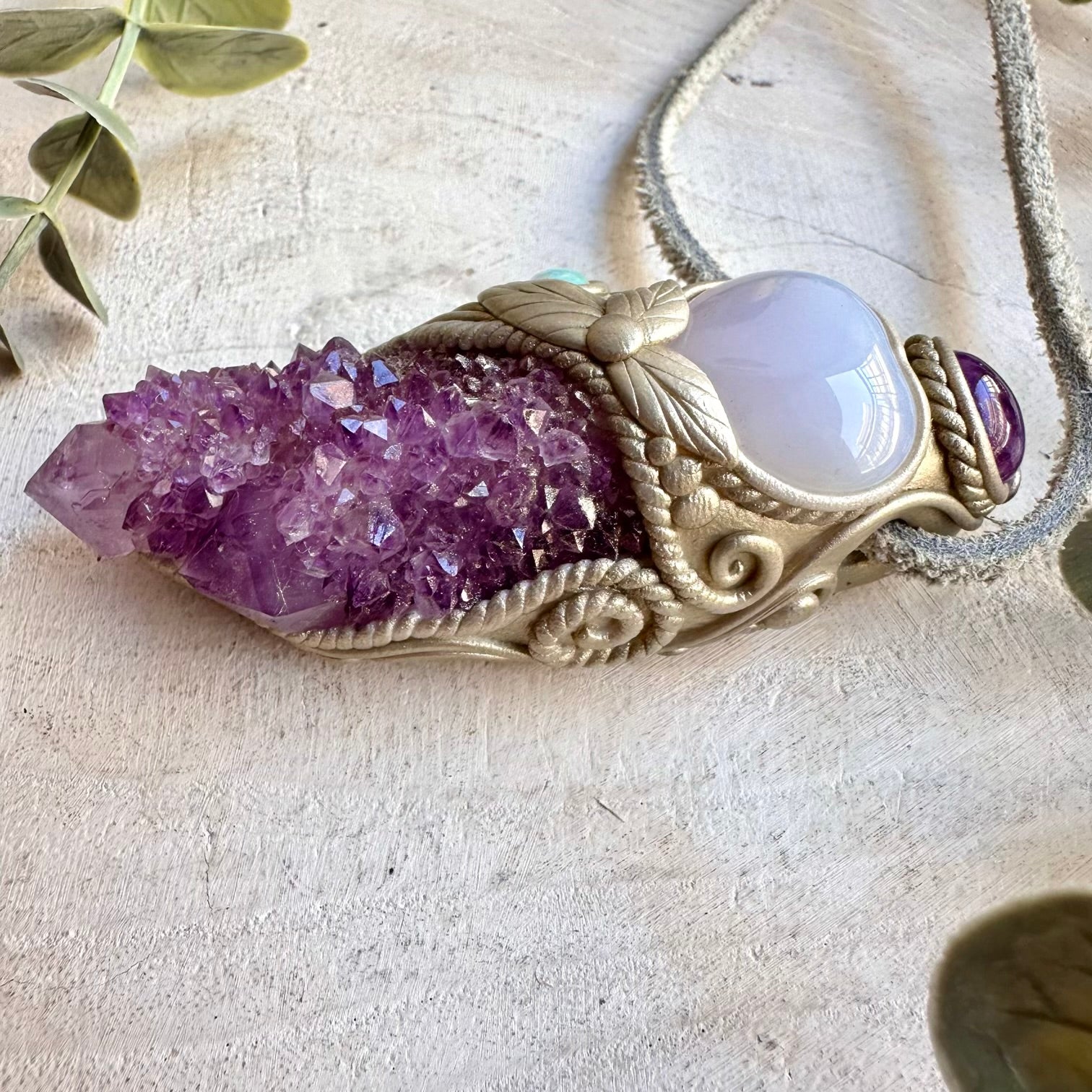 Handmade healing crystal necklace combining Spirit Quartz with a soft blue Blue Chalcedony Heart.