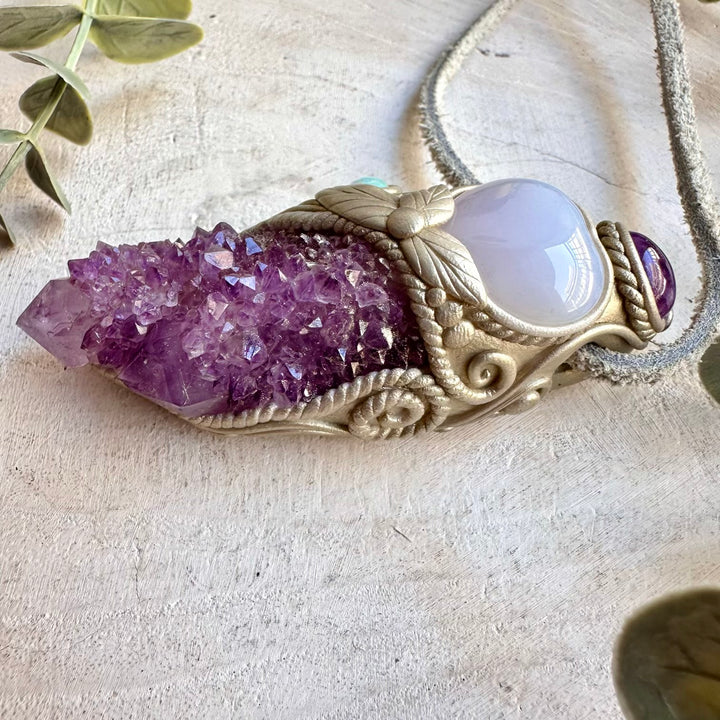 Handmade healing crystal necklace combining Spirit Quartz with a soft blue Blue Chalcedony Heart.